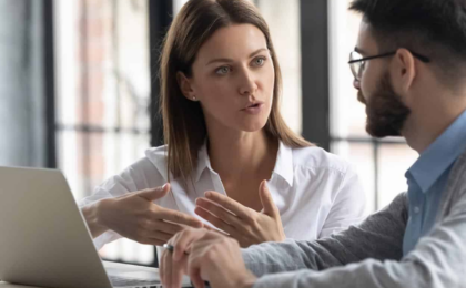 IT consulting professionals discussing technology solutions in a modern Chicago office.