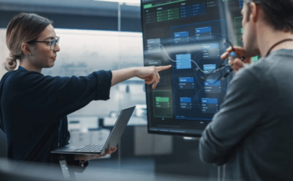 IT professionals discussing system architecture during a managed services consultation in Chicago