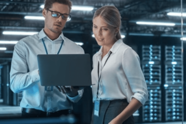 Cybersecurity consulting experts reviewing network data in a secure server room – GO Technology Group, Chicago cybersecurity consulting services