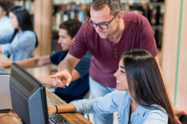 IT mentor helping future technology professionals develop cloud and cybersecurity support skills