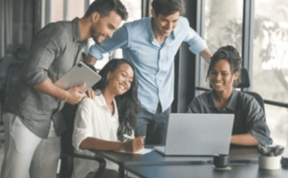 Business team collaborating on AI strategy consulting and IT modernization planning in a professional office setting