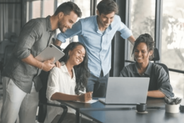 Business team collaborating on AI strategy consulting and IT modernization planning in a professional office setting