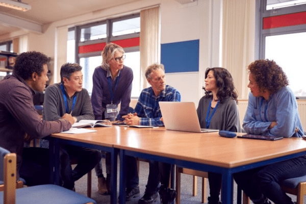 Education technology - school technology plan School leadership team collaborating on a school technology plan during a technology change discussion