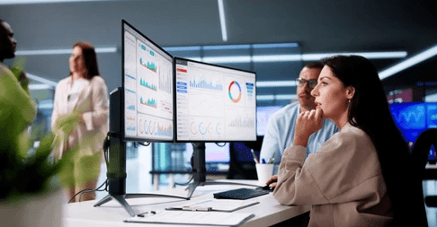Addressing AI Security Concerns in Finance Expert Advice Business professionals analyzing dashboards as part of cloud innovation strategy and data analytics.