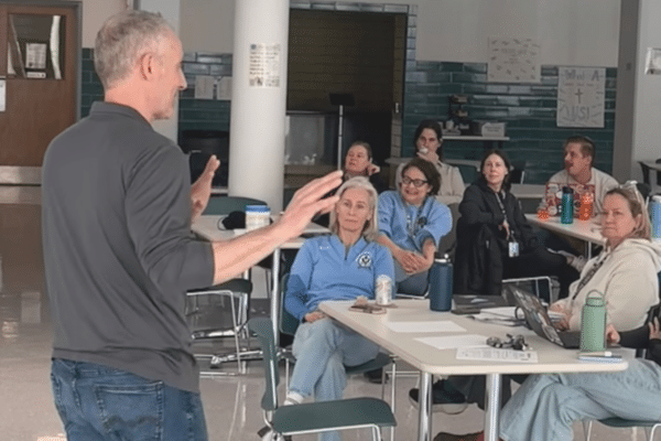 AI cybersecurity presentation for school leaders in Chicago classroom setting