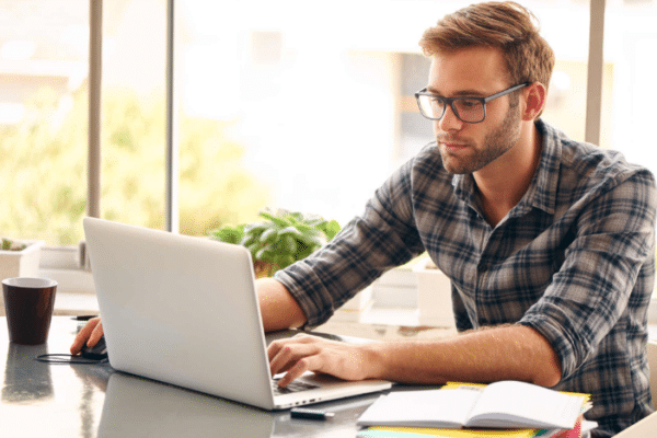Employee completing security awareness training on laptop to learn how to identify cybersecurity threats