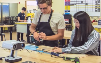 Library makerspace users working with tools and technology in a collaborative learning environment