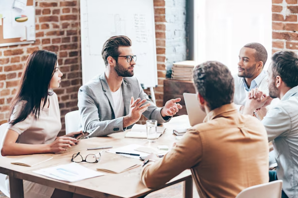 Business leaders meeting with a proactive IT consulting team to discuss cybersecurity, technology strategy, and managed IT services in Chicago