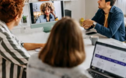 Business professionals collaborating in a hybrid work meeting using remote communication and cloud collaboration tools