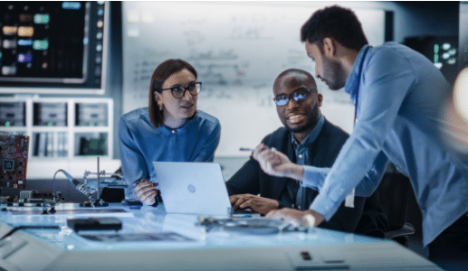 Business leaders discussing a digital transformation strategy involving cloud technology, cybersecurity, AI adoption, and operational modernization