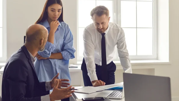 Business leaders reviewing a disaster recovery plan to strengthen business continuity and technology resilience for a growing Chicago organization.